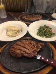 Hoskins Restaurant signature dishes Old Fashion Hamburger, Smoked Chopped Barbecue Sandwich, Rib Eye Steak.